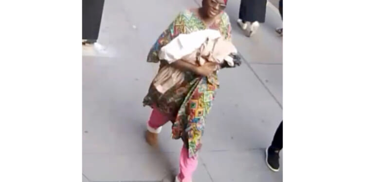 This photo taken from surveillance video footage provided by the New York Police Department, shows a woman who is wanted for questioning after an infant girl was abandoned at a New York City subway station Monday.