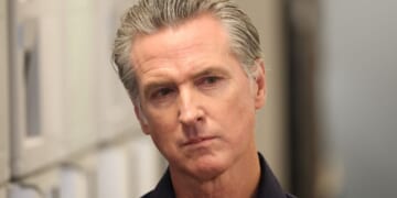 Gov. Gavin Newsom listens before speaking during a news conference in Los Angeles, California, on Thursday.