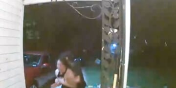 A woman appears to be abducted in Wichita, Kansas, as shown in footage posted by the Wichita Police Department on Oct. 13, 2025.