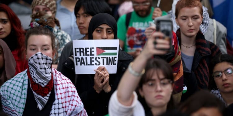 Protesters from a number of London universities attend a pro-Palestine demonstration on Oct. 7 in London, England. However, now that it's Hamas, rather than Israelis, killing Palestinians, the protesters appear to have gone silent.