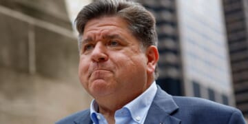 Illinois Gov. JB Pritzker waits to speak at a news conference in Chicago, Illinois, on Aug. 25.
