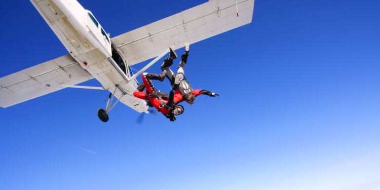 Parachuters jumping from a plane.