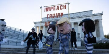 Activists from Free Speech For People dressed as Vice President J.D. Vance, Secretary of Homeland Security Kristi Noem, President Donald Trump, and White House Deputy Chief of Staff Stephen Miller participate in a rally at the Lincoln Memorial on Oct. 17, 2025, in Washington, D.C.