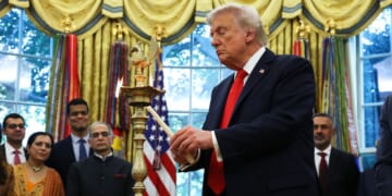 President Donald Trump lights a diya candle during an event celebrating Diwali in the Oval Office of the White House in Washington, D.C., on Tuesday.