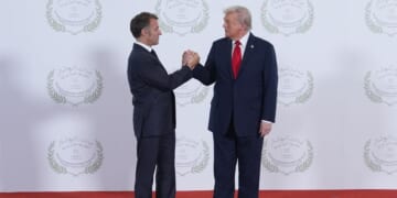 President Donald Trump greets France's President Emmanuel Macron during a summit of European and Middle Eastern leaders on Oct. 13, 2025, in Sharm El Sheikh, Egypt.