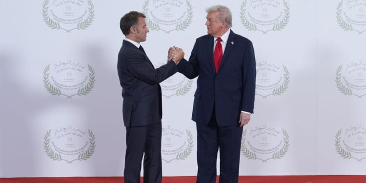 President Donald Trump greets France's President Emmanuel Macron during a summit of European and Middle Eastern leaders on Oct. 13, 2025, in Sharm El Sheikh, Egypt.