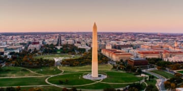 The National Mall in Washington, D.C., is photographed from a helicopter at sunset.