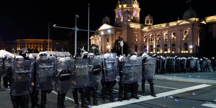 Riot police separate opponents, loyalists of Serbia's president as tensions soar amid protests