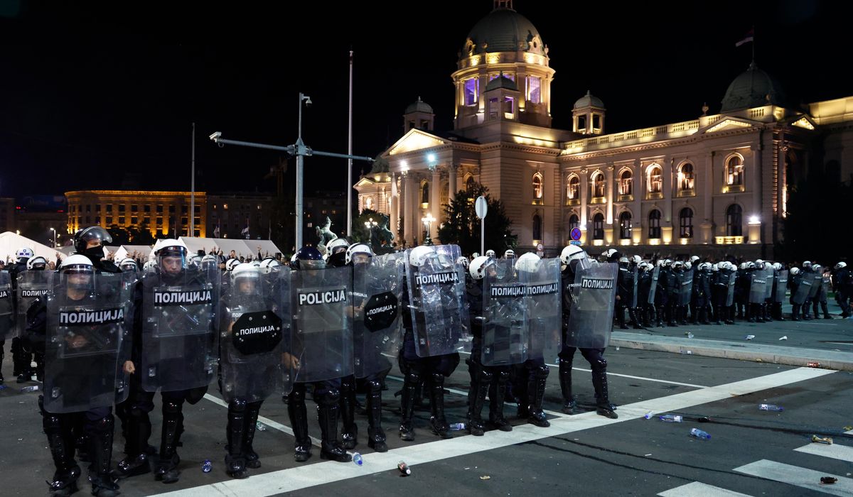 Riot police separate opponents, loyalists of Serbia's president as tensions soar amid protests