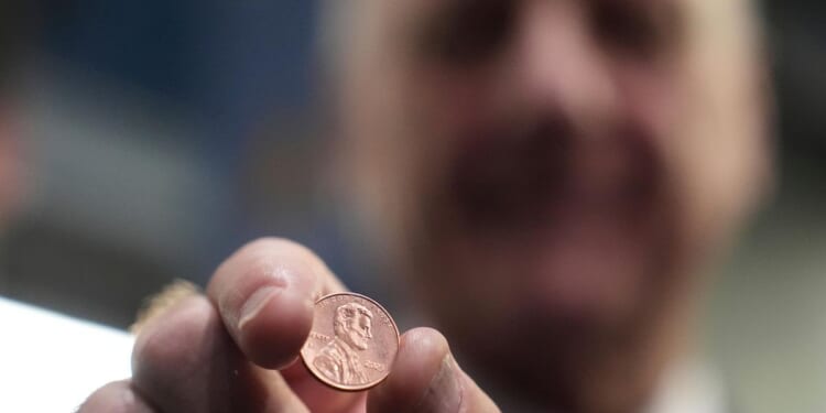Final pennies being pressed as production ends after more than 230 years
