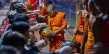 Buddhist monks in Laos pray in region littered with unexploded bombs
