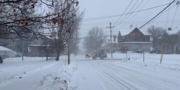 In Wisconsin, crews restoring power while Iowa airport tries to reopen after plane left icy runway