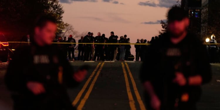 Emergency personnel stand near the White House where two National Guard soldiers were shot in Washington, DC on Nov. 26, 2025.