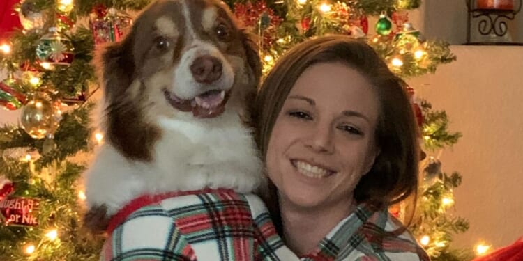 The Western Journal Supervising Story Editor Kassandra White poses for a Christmas photo with her dog Keller, affectionately called "The Floof."