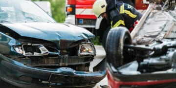 Firefighters at a car accident scene.