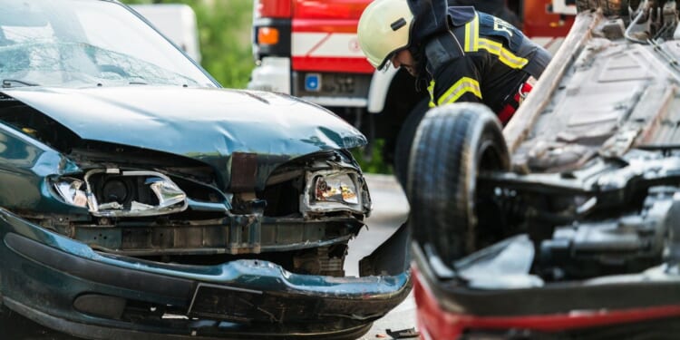 Firefighters at a car accident scene.