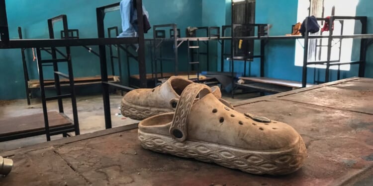 A pair of shoes is seen inside a student dormitory at St. Mary's Catholic School in Papiri, Agwarra local government, Niger state, on Nov. 23, 2025. Fifty of the more than 300 children snatched by militants from a Catholic school in Nigeria have escaped their captors, a Christian group said in a statement.