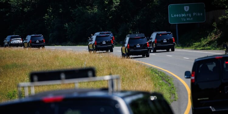 President Donald Trump rides in a motorcade to his private golf club on the morning of July 4, 2025, in Sterling, Virginia.