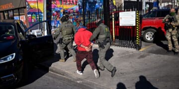 U.S. Border Patrol officers arrest an individual Nov. 6 in the Little Village neighborhood of Chicago, Illinois. (Joshua Lott - The Washington Post / Getty Images)
