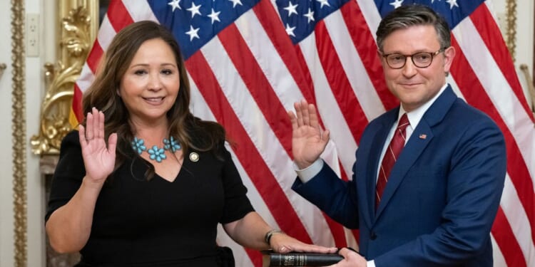 Rep. Adelita Grijalva, a Democrat from Arizona, re-enacts her swearing-in by Speaker of the House Mike Johnson, a Republican from Louisiana, at the U.S. Capitol in Washington, D.C., on Nov. 12, 2025.