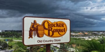 A Cracker Barrel sign featuring the restaurant chain's iconic logo stands outside a restaurant in Florida City, Florida on Aug. 27, 2025.