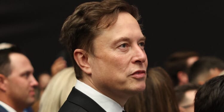 Elon Musk attends the public memorial service for Charlie Kirk in Glendale, Arizona, on Sept. 21.