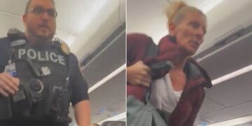 The disruptive passenger was escorted off the plane in Kansas City.