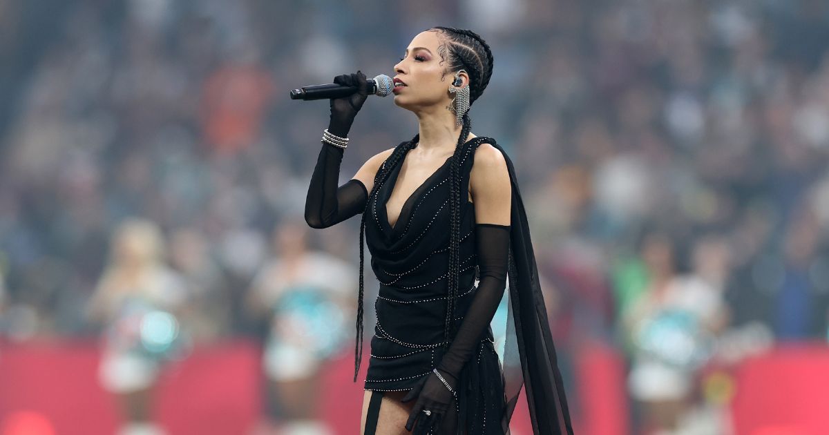 Karina Pasian sings the national anthem prior to the NFL 2025 game between Washington Commanders and Miami Dolphins at Estadio Santiago Bernabeu on Nov. 16, 2025, in Madrid, Spain.
