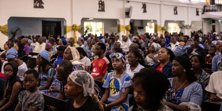 Catholics in Nigeria gather to worship in a church in Lagos, Nigeria on April 21, 2025.