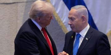 President Donald Trump Israeli and Prime Minister Benjamin Netanyahu interact after Netanyahu addressed the Knesset on Oct. 13, 2025, in Jerusalem.