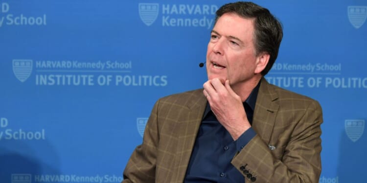 Former FBI Director James Comey speaks at Harvard Kennedy School with Harvard's Eric Rosenbach on Feb. 24, 2020, in Boston, Massachusetts.