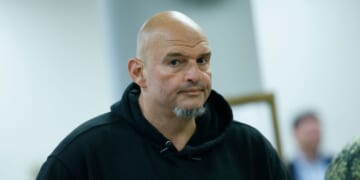 Sen. John Fetterman, a Democrat from Pennsylvania, walks to vote at the U.S. Capitol on Oct. 8, 2025, in Washington, D.C.