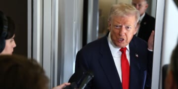 President Donald Trump speaks to members of the media on board Air Force One on Oct. 31, 2025, at Joint Base Andrews, Maryland.