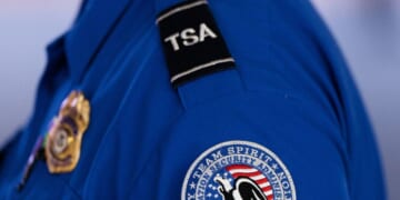 An employee of the Transportation Security Administration stands at Orlando International Airport in Orlando, Florida, on Nov. 9, 2025.