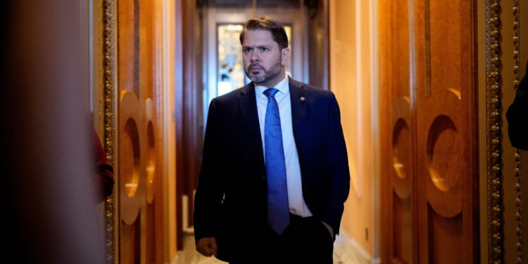 Sen. Ruben Gallego walks out of the Senate Chamber of the US Capitol Building on Oct. 1, 2025.