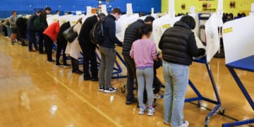 People vote at a polling location at the High School of Art and Design in the Manhattan borough of New York City on Tuesday.