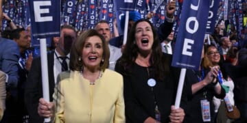 Former House Speaker Nancy Pelosi, left, and her daughter Christine Pelosi hold "We Love Joe" signs in a file photo from Aug. 19, 2024, as then-President Joe Biden spoke on the first day of the Democratic National Convention in Chicago, Illinois.