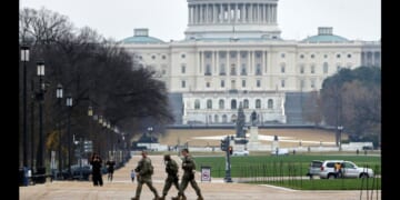 National Guard troops patrol on the National Mall near the US Capitol on Nov. 26, 2025 in Washington, DC.