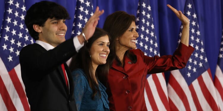 Then-presidential candidate Nikki Haley waves to supporters alongside her son, Nalin Haley, and her daughter, Rena Haley, in Charleston, South Carolina, on February 24, 2024.