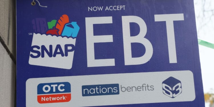 An EBT sign is displayed in the window of a grocery store in New York City on Oct. 30, 2025.