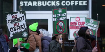 Protesters picket outside a Starbucks, Thursday in Philadelphia.
