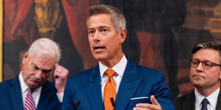 Secretary of Transportation Sean Duffy speaks alongside Rep. Tom Emmer, a Republican from Minnesota, and Speaker of the House Mike Johnson, a Republican from Louisiana, during a press conference on air traffic controller pay and the government shutdown at the U.S. Capitol on Oct. 23, 2025, in Washington, D.C.