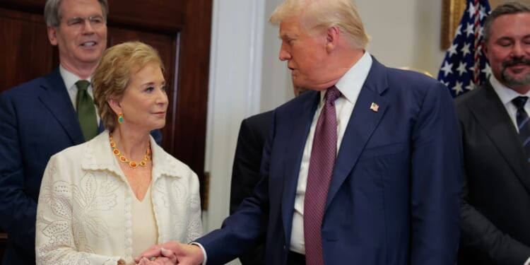 President Donald Trump speaks with Secretary of Education Linda McMahon during an executive order signing ceremony in the Roosevelt Room of the White House on July 31, 2025, in Washington, D.C.