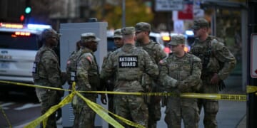 National Guard soldiers gather near a crime scene after a shooting in downtown Washington, D.C., on Nov. 26, 2025.