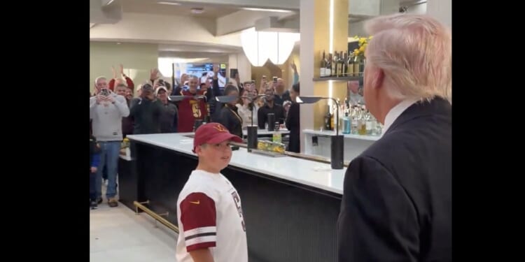 President Donald Trump greeted a young fan at Sunday’s NFL game between Washington and Detroit.. (Screenshot / Margo Martin on X)