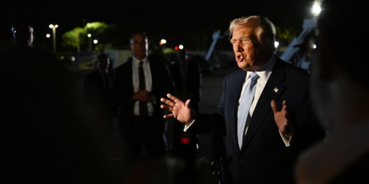 President Donald Trump speaks to reporters before boarding Air Force One at Palm Beach International Airport in West Palm Beach, Florida, on Nov. 16, 2025.