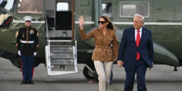 President Donald Trump and First Lady Melania Trump walk across the tarmac from the Marine One helicopter toward Air Force One at Stansted Airport, in Stansted, north of London, on Sept. 18, 2025.