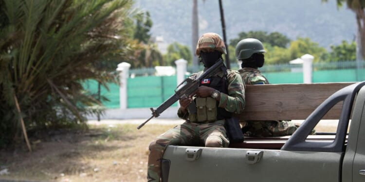 Members of the Haitian armed forces patrol the city center near the National Palace in Port-au-Prince on Oct. 1, 2025.