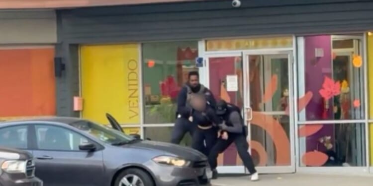 ICE agents arrest an illegal immigrants who was working as a teacher at Rayito de Sol Spanish Immersion Early Learning Center in Chicago, Illinois, on Wednesday.