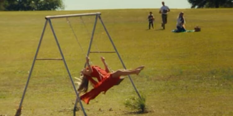 Grammy-nominated country star Kelsea Ballerini questions her life choices in her song "I Sit in Parks."